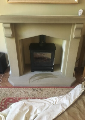 Heta 45 woodburning stove with a  limestone suite & 316 graded stainless steel liner.  Wordsley, Kingswinford.